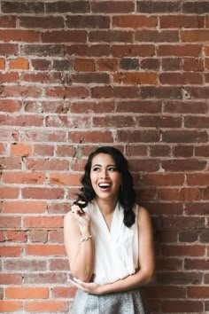 Before: portrait photo in front of a brick wall